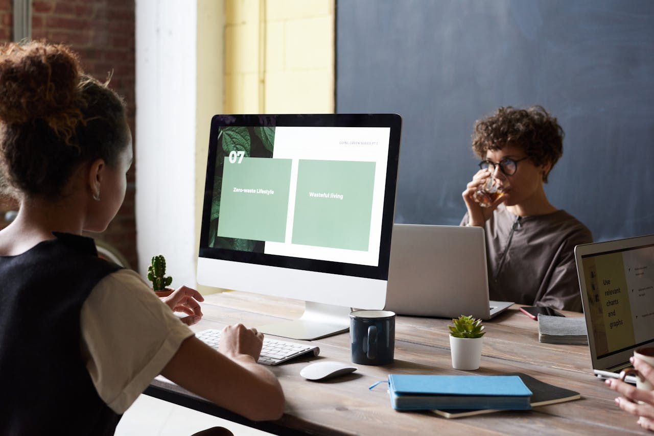 Colleagues discussing ideas and strategies during a team meeting in a modern office setting.